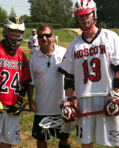 Rick Mercurio (c.) coaching lacrosse in Moscow.