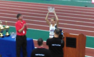 Michta accepting her award after winning the one-mile race walk.