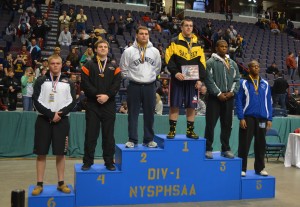 Mills on top of the state school podium.