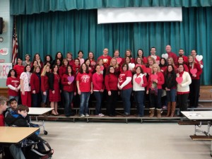 Faculty and staff members at Merrimac wearing red.