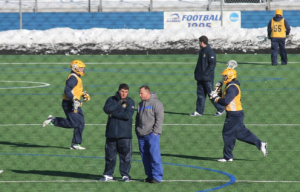 Joe Amplo and Hofstra coach Seth Tierney talk at Shuart Stadium.