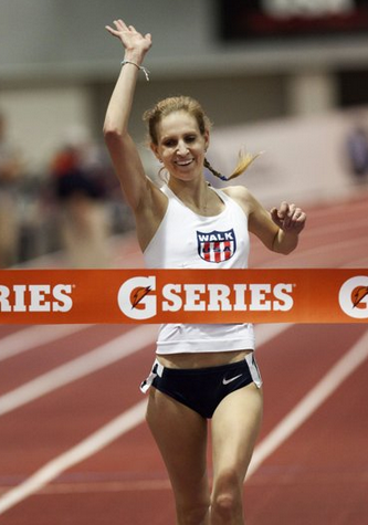 Michta crossing the finish line during the 3,000-meter race walk championship.