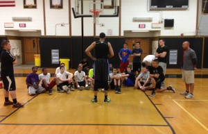 Harris talking with Sachem basketball players.