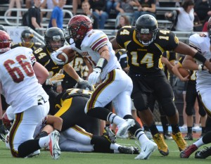 Tim Condon carries the ball for Sachem East.