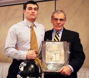 Justin Rivera receiving his Black Helmet Award from Fred Fusaro.