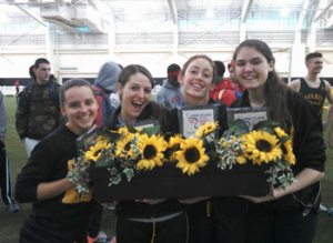 Sachem's 4x200 celebrates a sub-1:46 relay with sunflowers!
