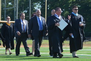 Sachem administrators and board members entering the field.