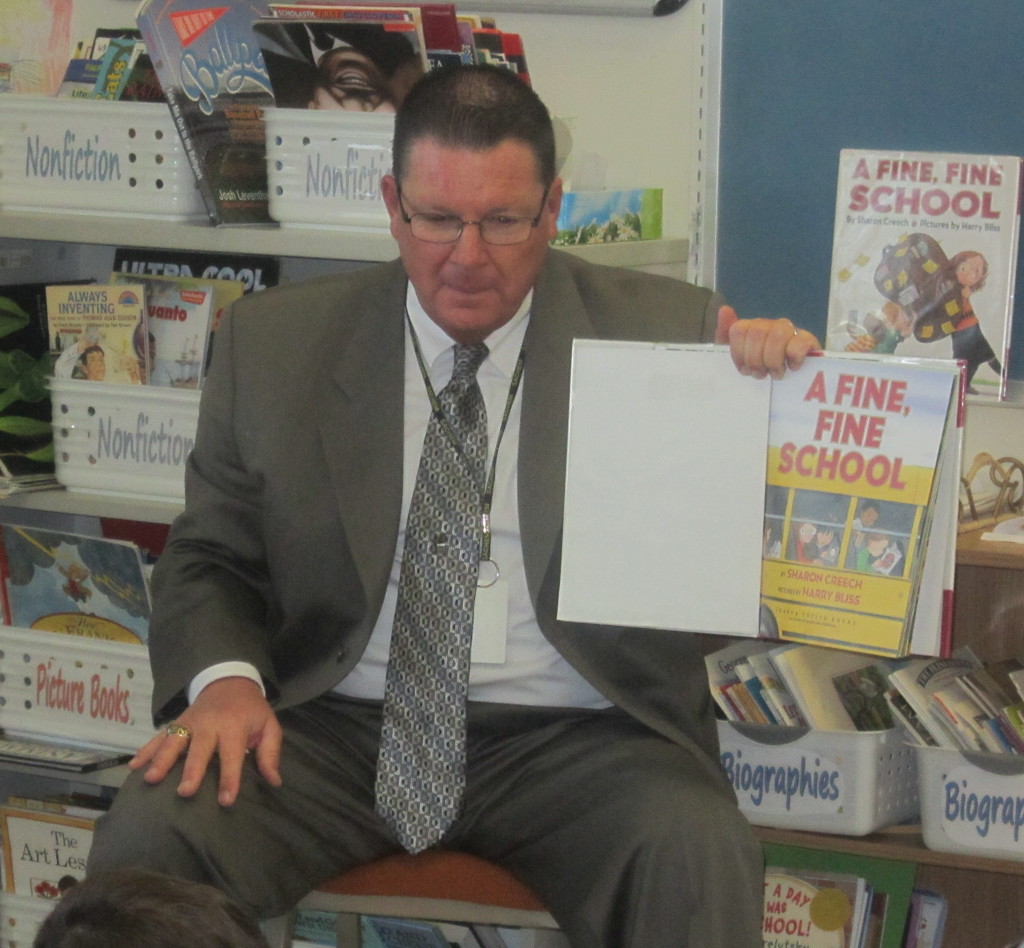 Sachem Superintendent James Nolan reading to kids.