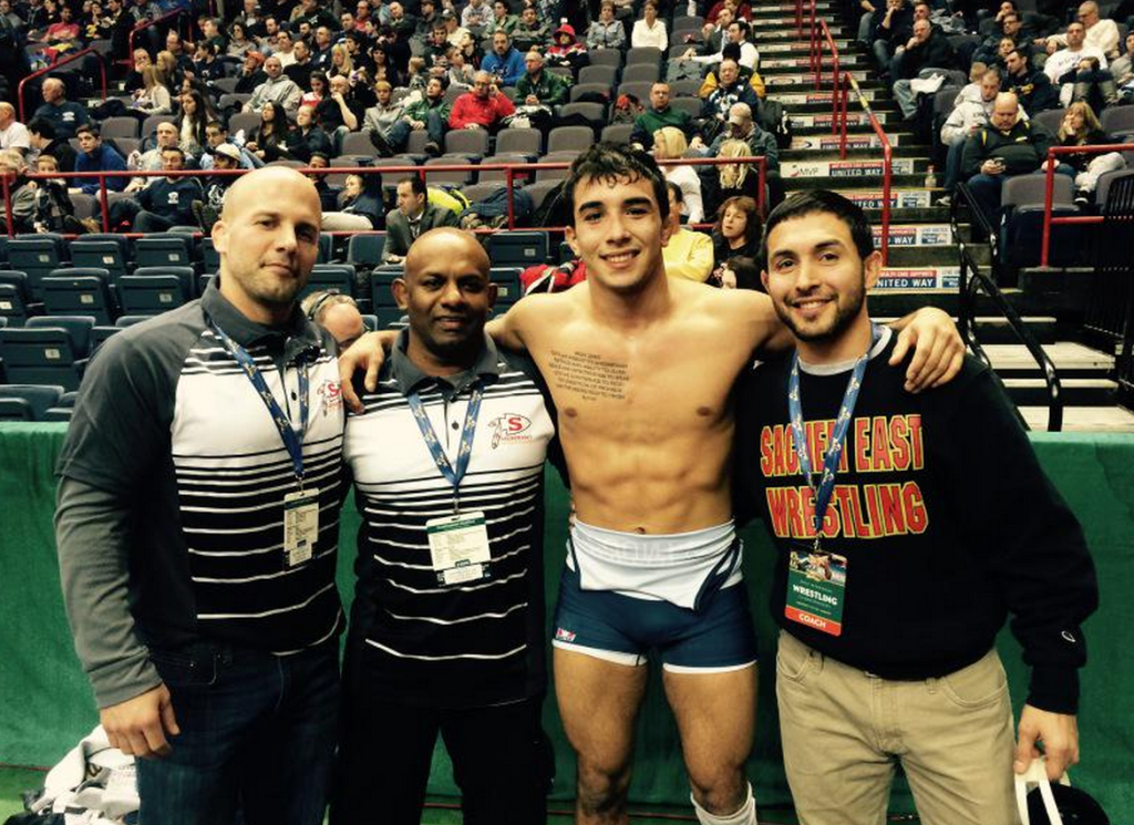 Sachem East wrestling coaches along with Restrepo and his dad.