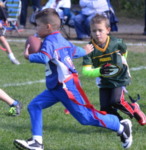 The Giants playing the Packers in SSC's flag football program.