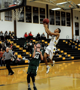 Nakari Nelson drives in for a lay-up. / Photo Credit Artie Weingartner